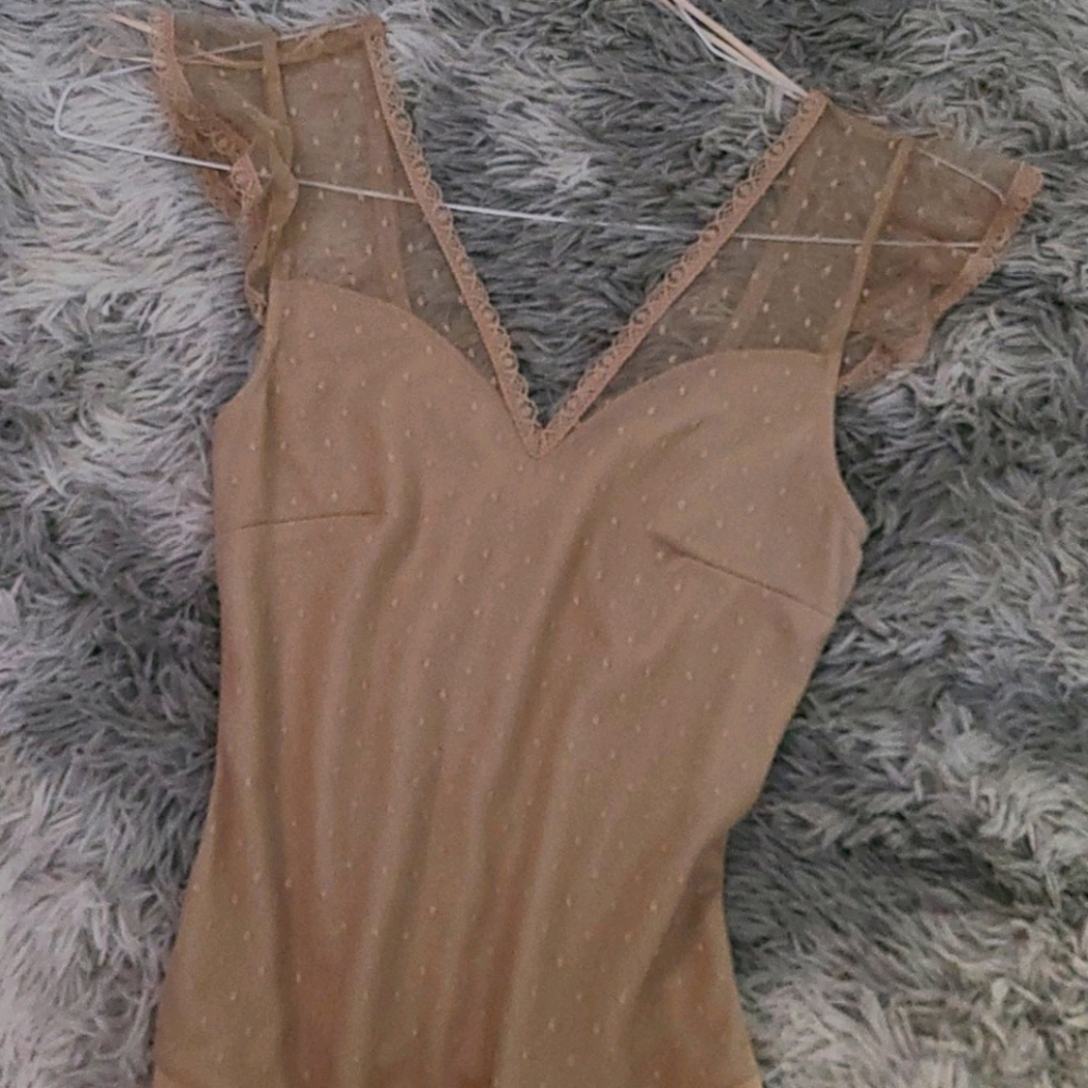 Stunning never worn nude bodysuit with lace